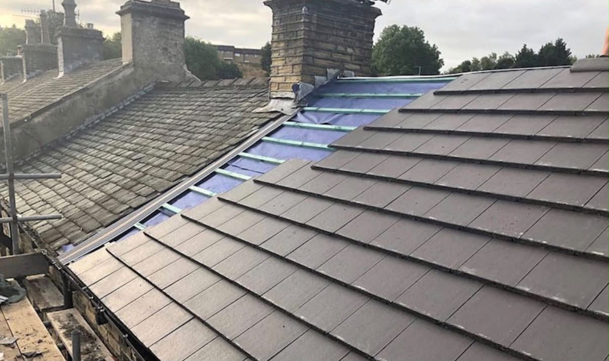 New tiles and underlay laid over the old roof
